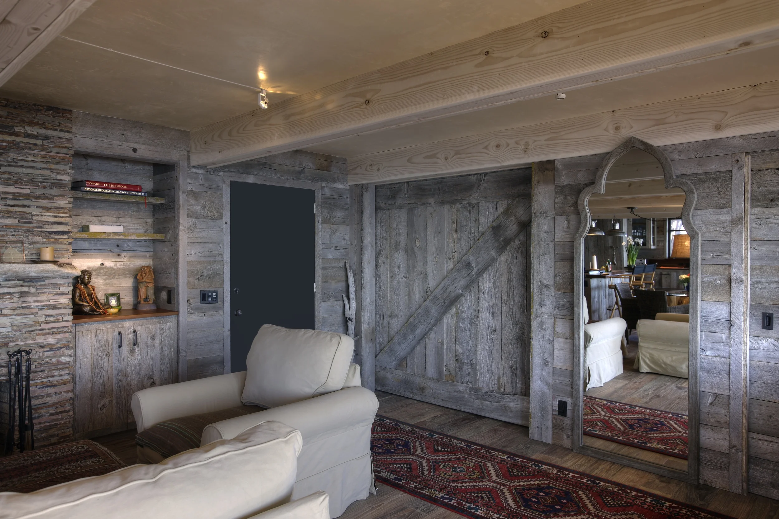 All the exterior surfaces of the cabinetry, columns, walls, doors and trim are reclaimed California Douglas fir barn wood. This required exact hand work by our team of talented cabinetmakers and carpenters. Every board was selected for its color, grain and texture to work with its adjoining neighbors, inspiring everone from the owners to craftsmen.