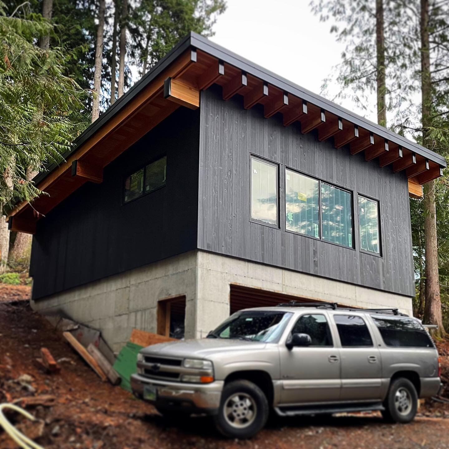#projectprogressupdate  The Shou Sugi Ban siding for the Skagit County Lakehouse is making its appearance on the ADU garage at the rear of the house.
 
Shou Sugi Ban (or Yakisugi) is an ancient Japanese exterior siding technique that strengthens the 