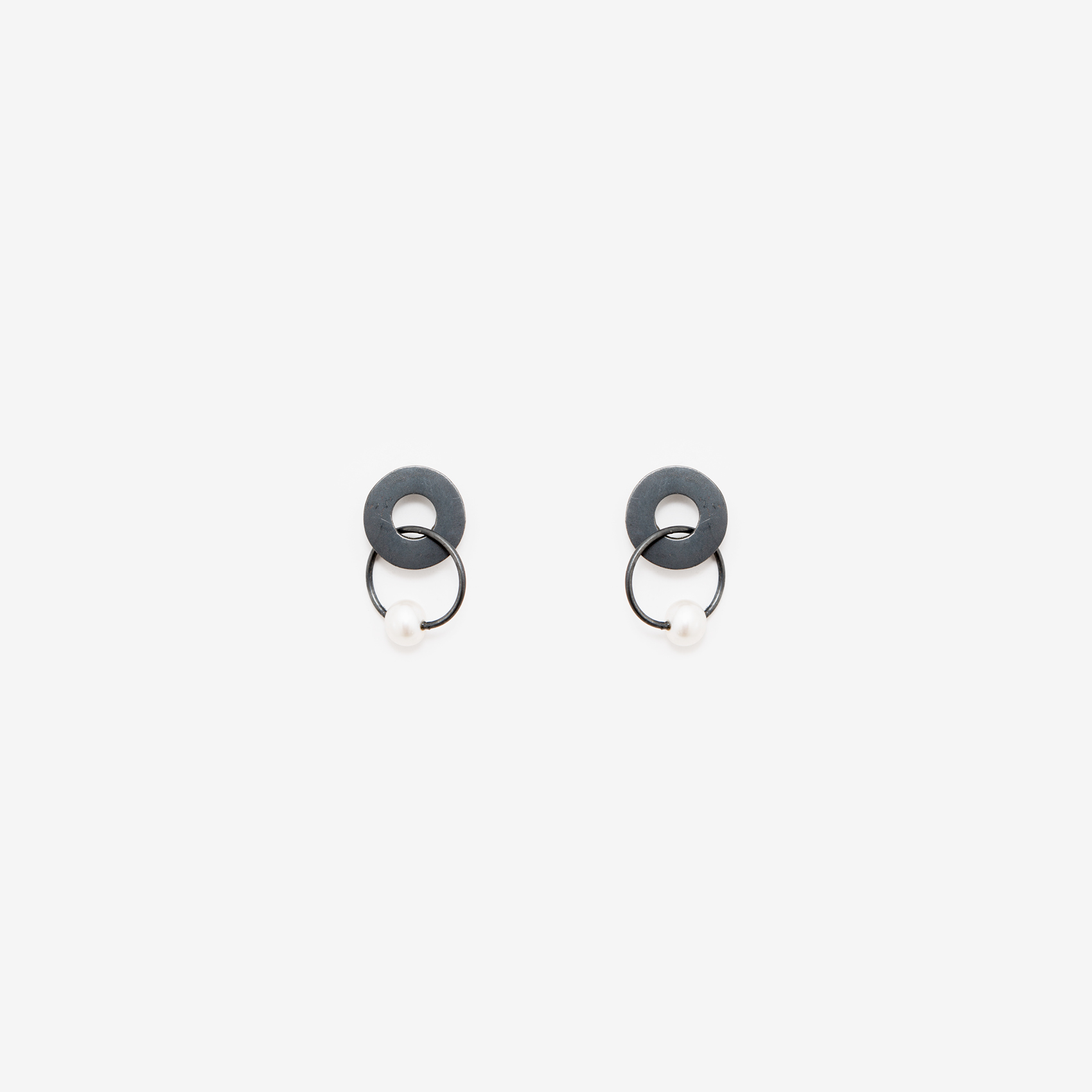 disc with a dangling pearl earring