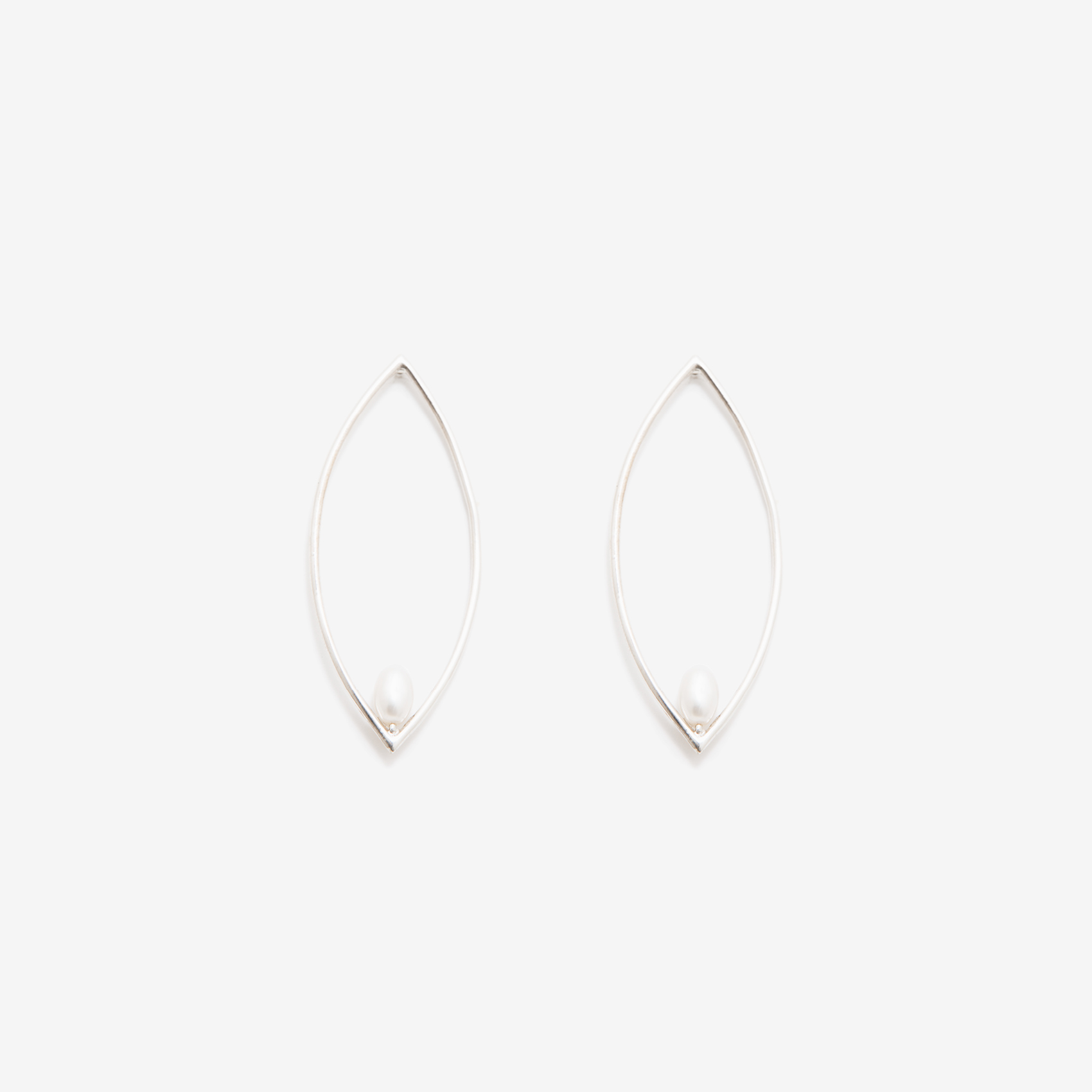 small oval earring with a pearl