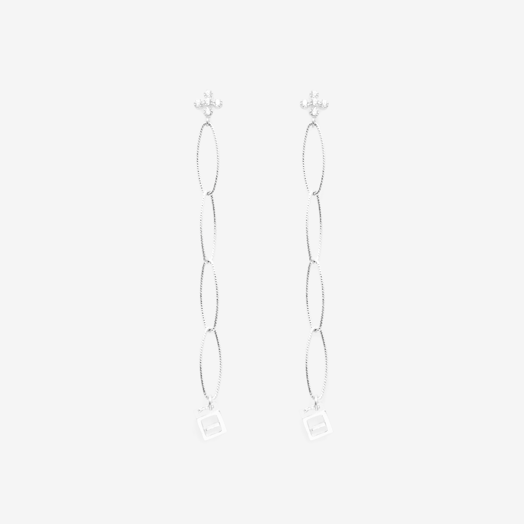 4 tier oval with dangling small cube with cubic zirconia top