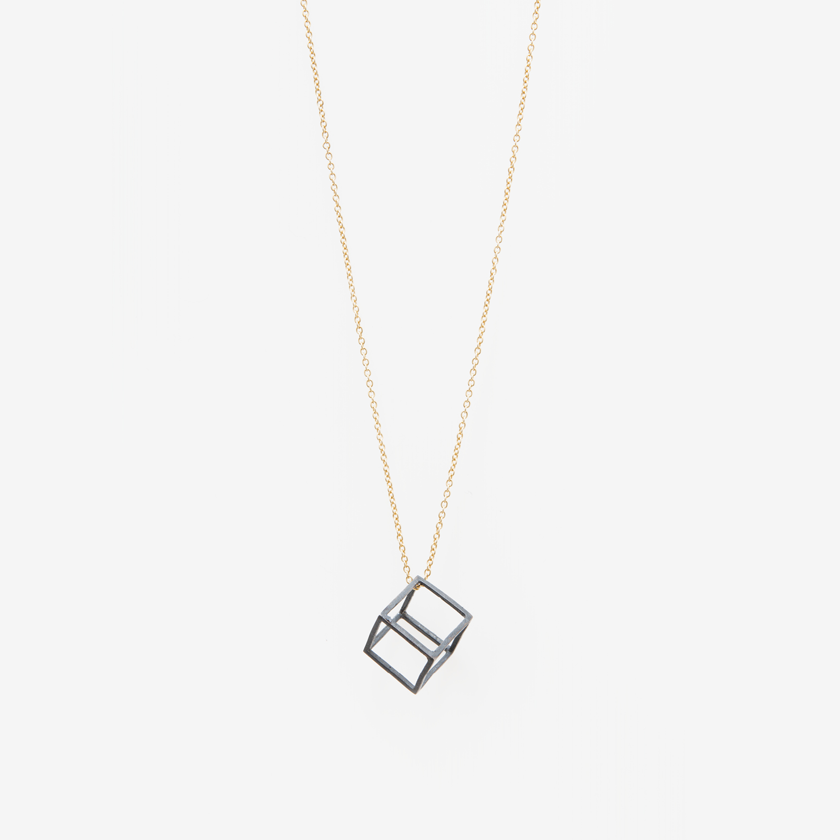 medium cube with chain/oxidized cube, gold chain