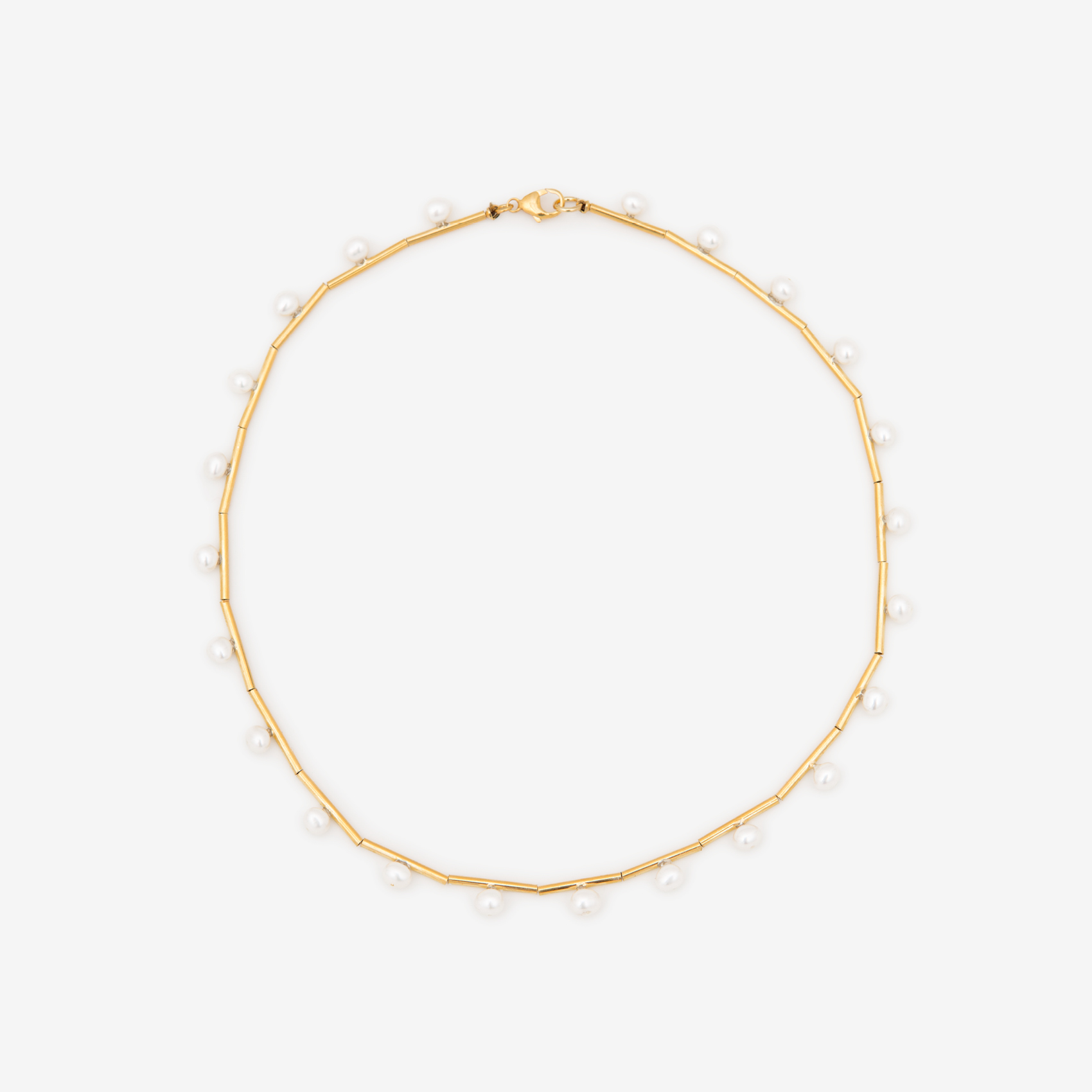tubing with soldered posts with pearls/gold
