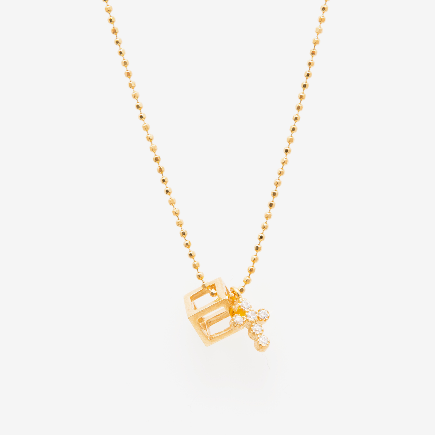 small cube with a charm