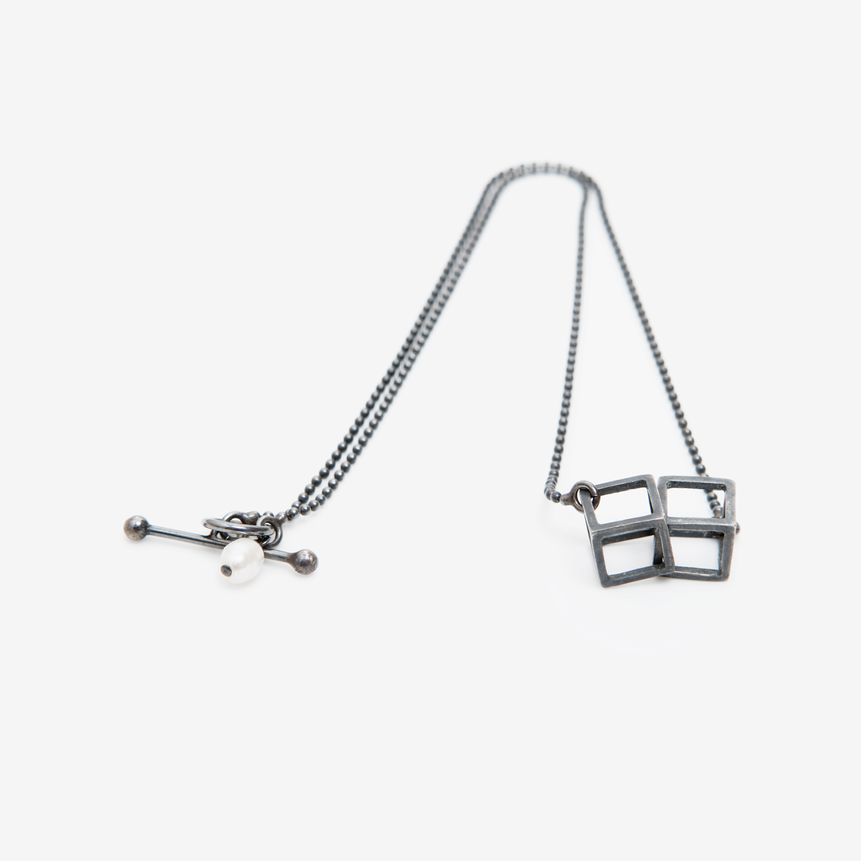 2 interlocking cubes with ball chain/oxidized