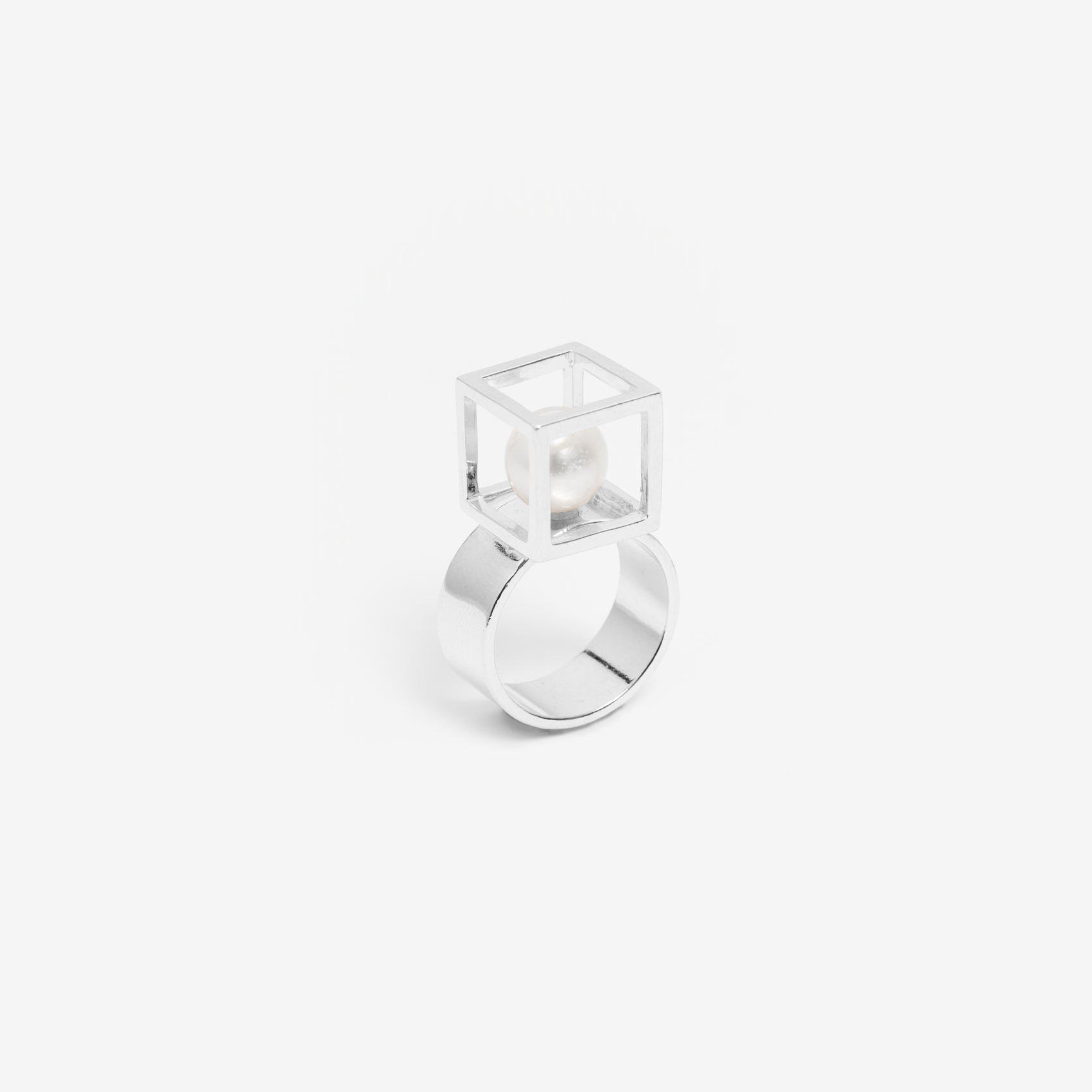 large cube ring with a pearl/gold