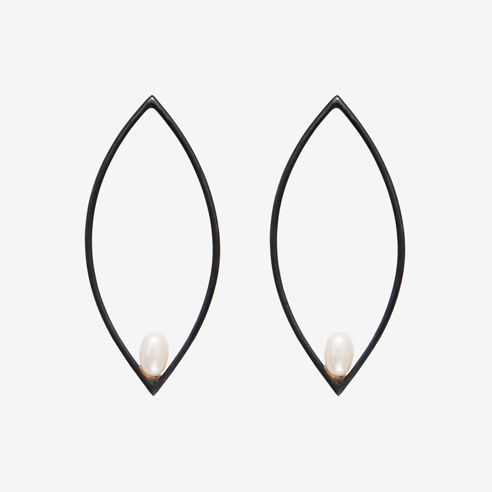 large oval earring with a pearl