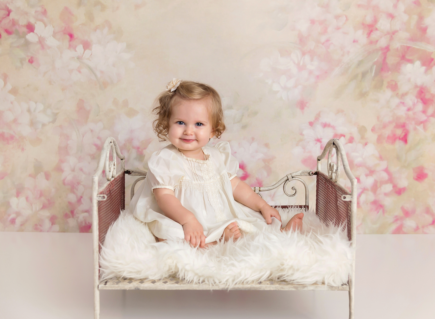 one year milestone portrait session of girl sitting in daybed.jpg