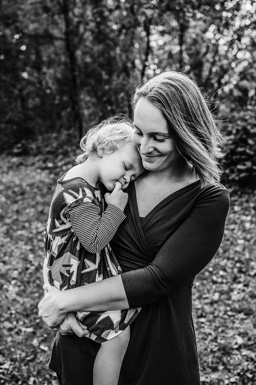 mom and daughter embracing in black and white.jpg