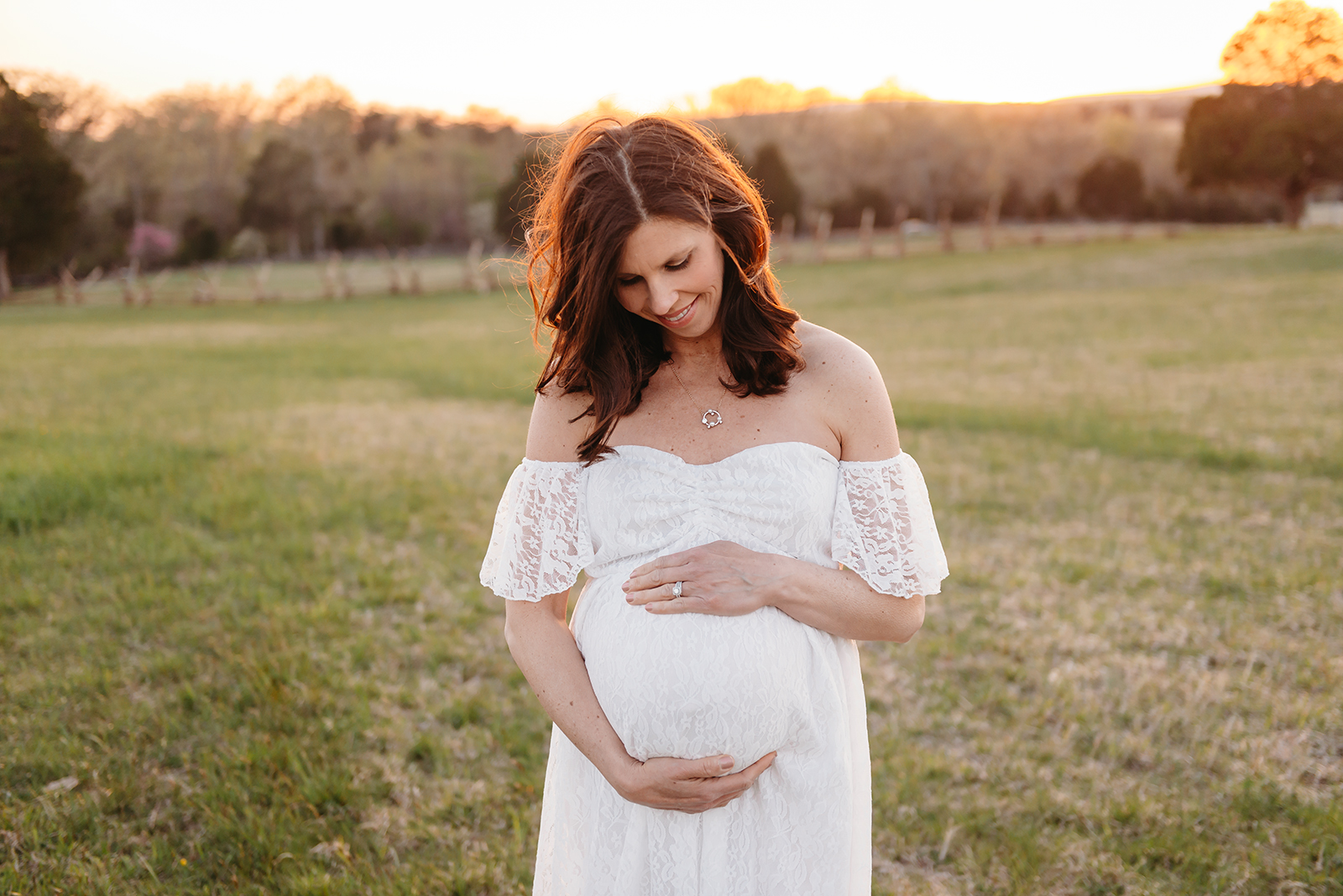 Manassas Battlefield maternity session white gown of mama looking at belly