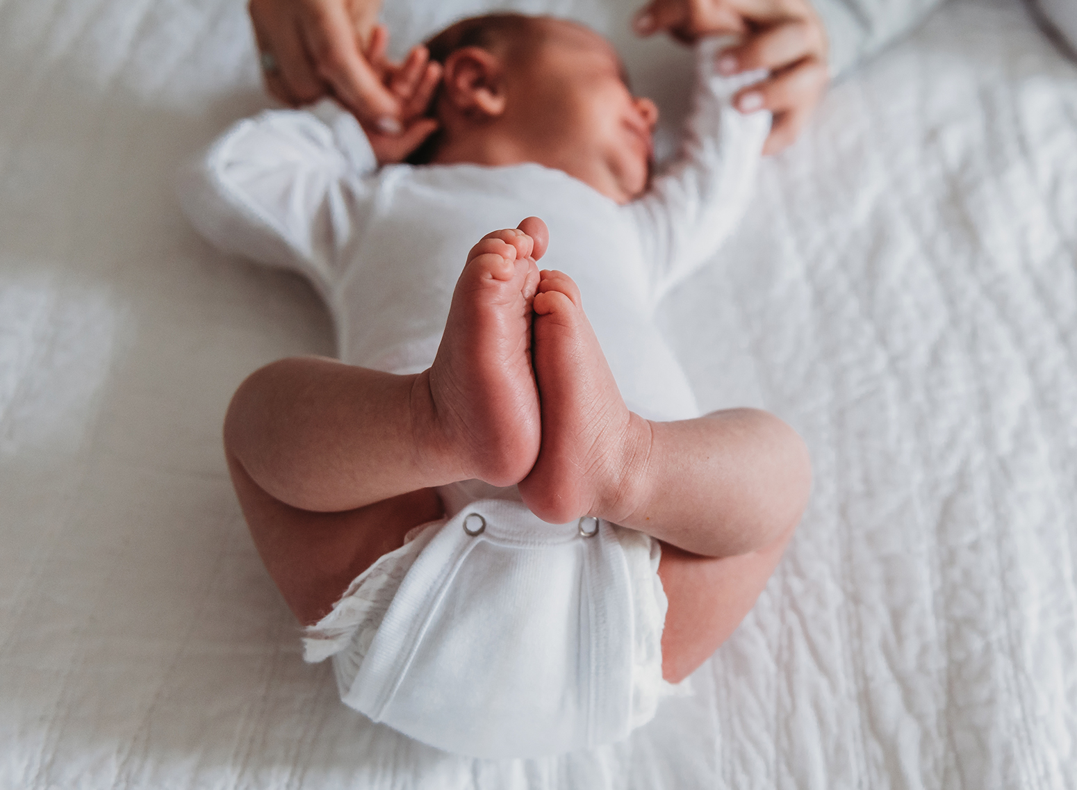 newborn feet and toes pressed together.jpg