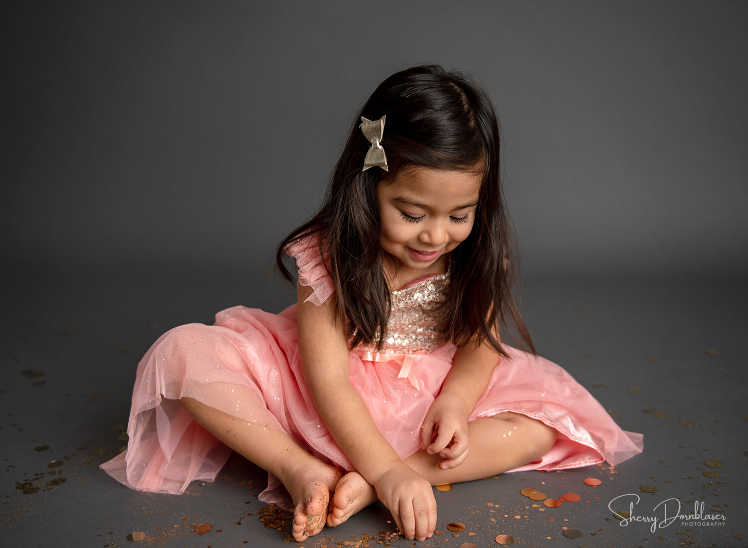 girl playing with glitter on floor B.jpg