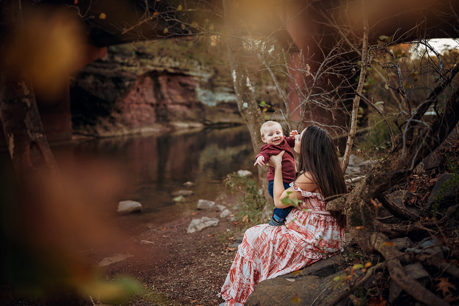 mom with baby on her lap sitting by the water.jpg