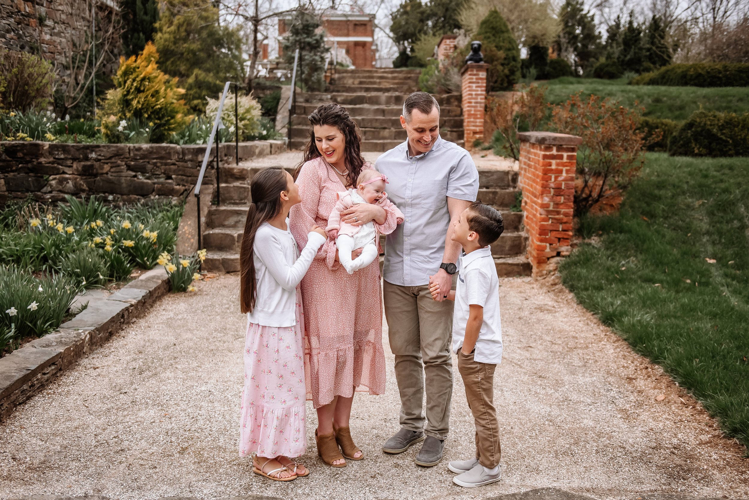 Family standing together pose with smiling baby.jpg