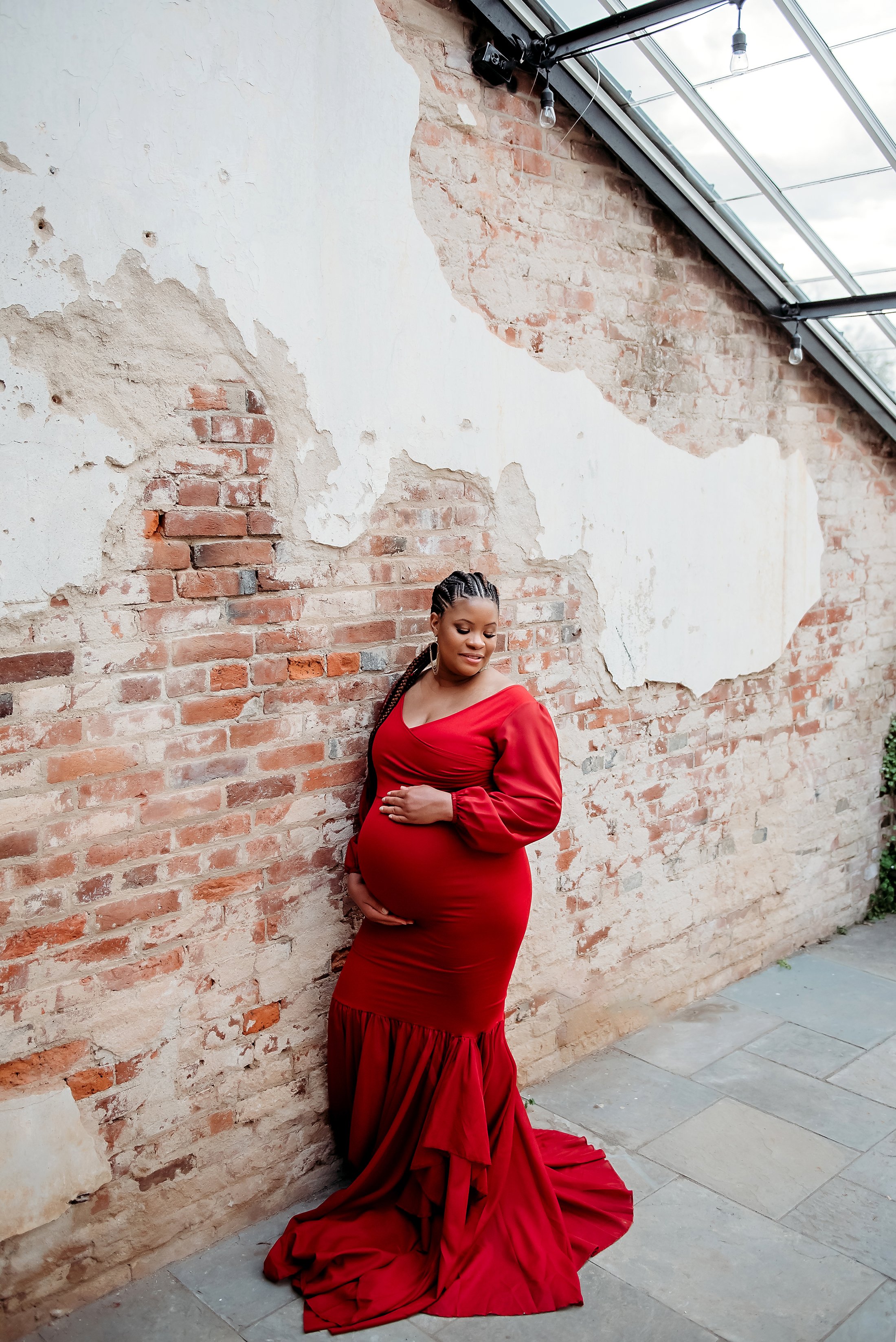 maternity mama wearing a red dress industrial building in virginia.jpg