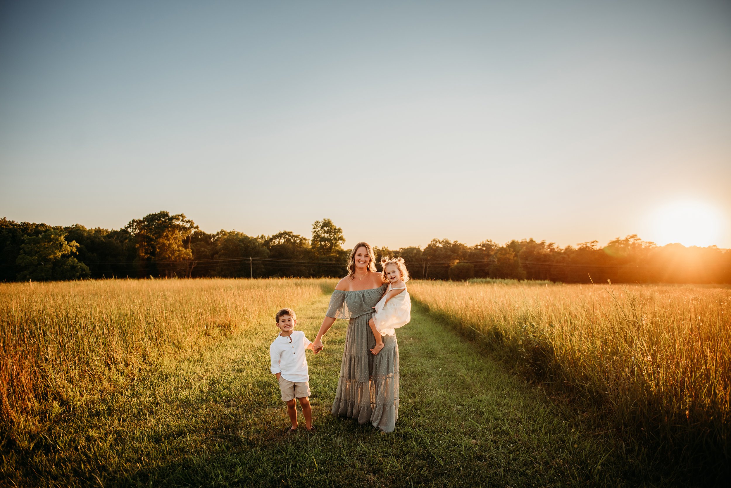 walking with kids in grass field.jpg