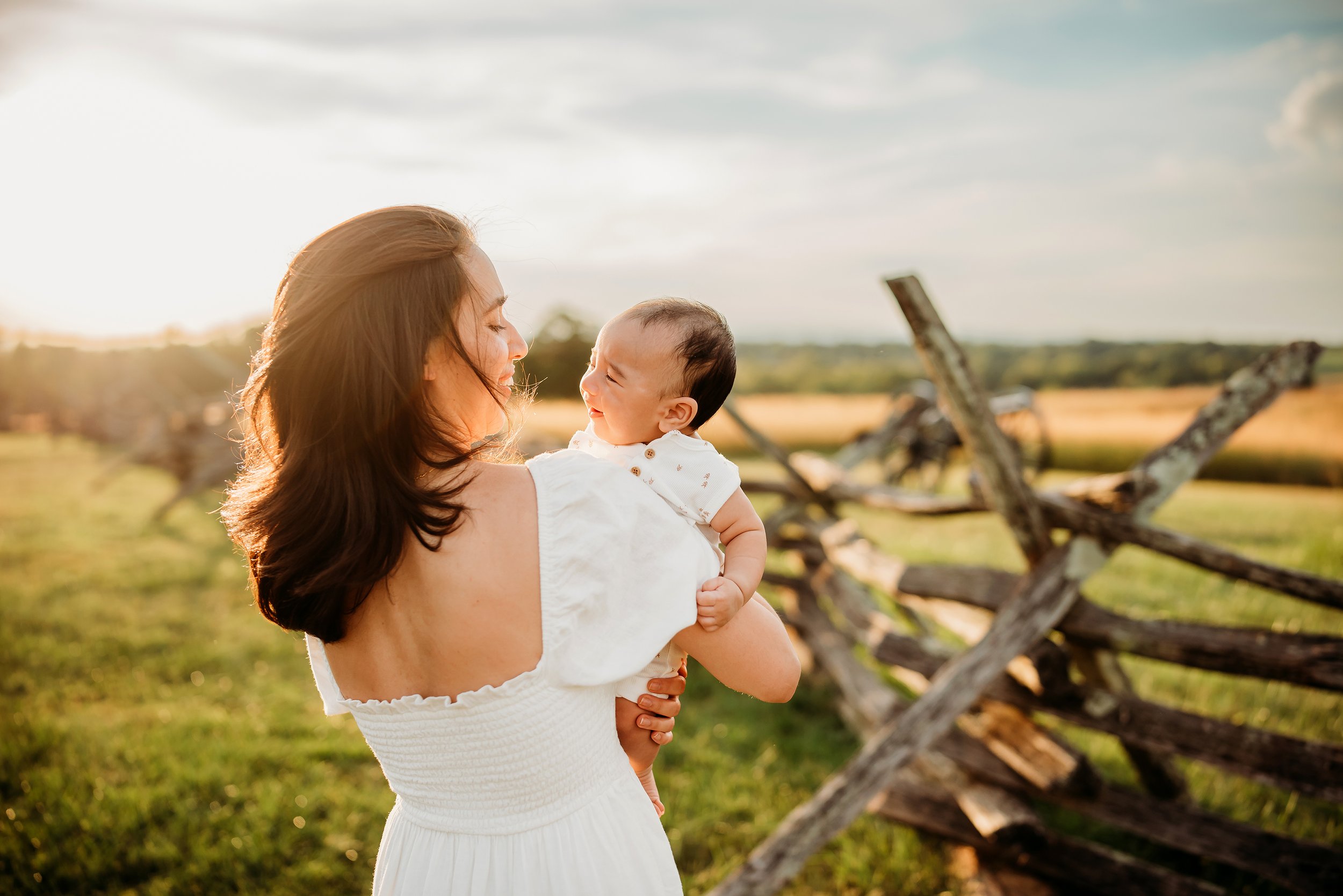 mom holding baby smiling at each other family virginia.jpg