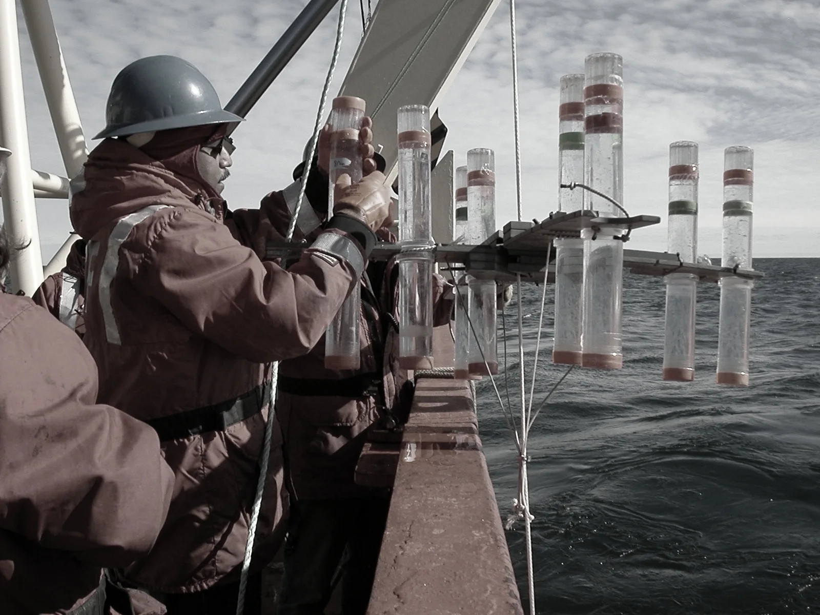 Oceanographer Joaquim Goes from Lamont-Doherty Earth Observatory recovers floating sediment traps during a research cruise in Antarctica’s Ross Sea. The traps collect debris falling through the water column, such as dead sea creatures, microscopic shells, dust and minerals // photo. Wade Jeffrey