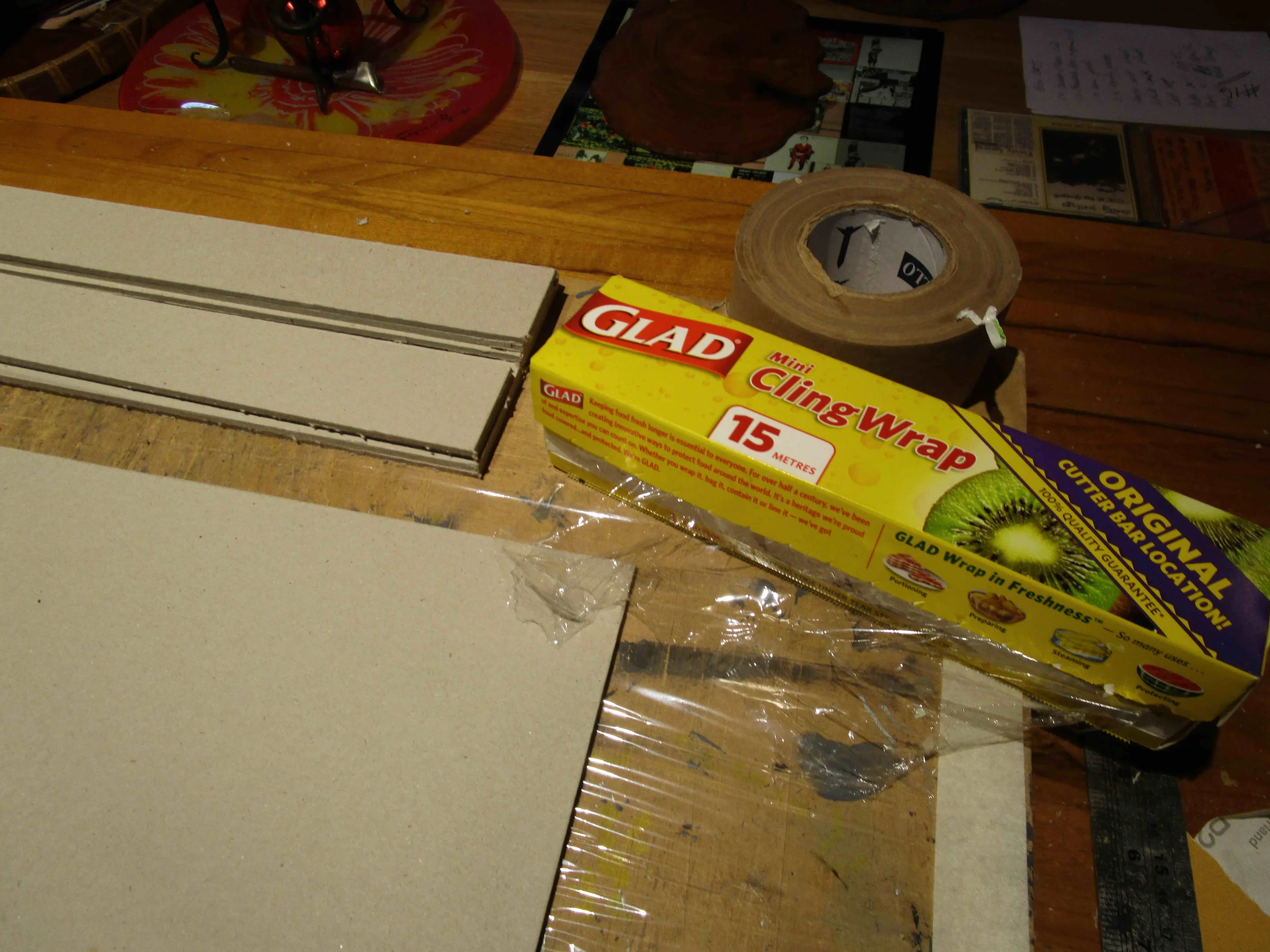 Line gluing and cutting board with cling wrap