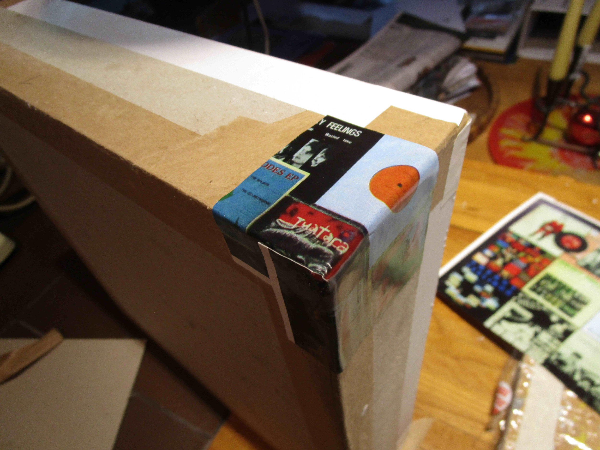 Outer corner lining. The outer lining chosen is the insert from the LP set, being a stitched photo montage of my Sneaky Feelings record collection.