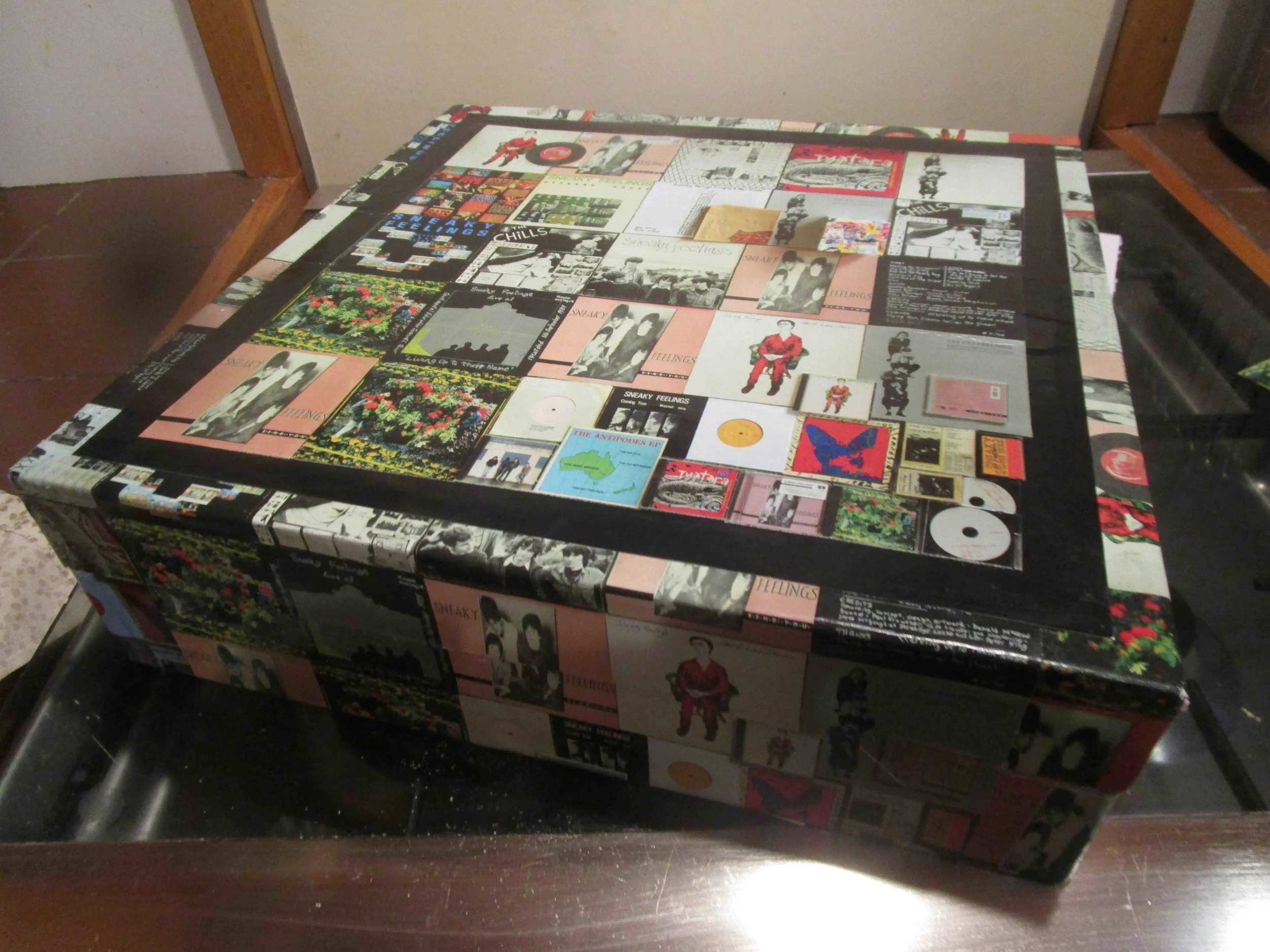 The top lining in place. Use photo glue for the main part, PVA around the edges for better adhesion, Wipe away excess PVA quickly with a damp cloth