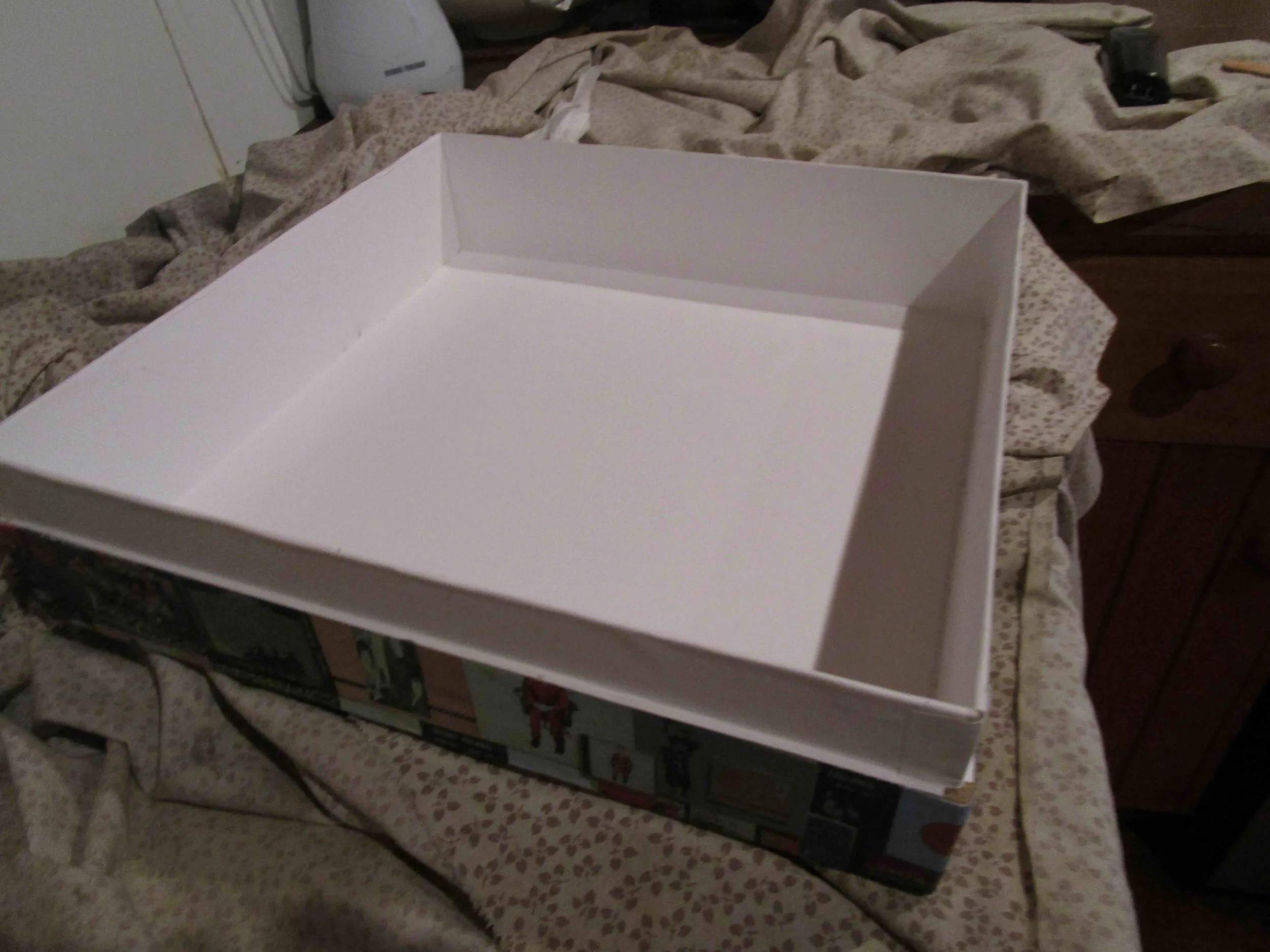 Box base lining complete. Fold ledges for a neat fit.