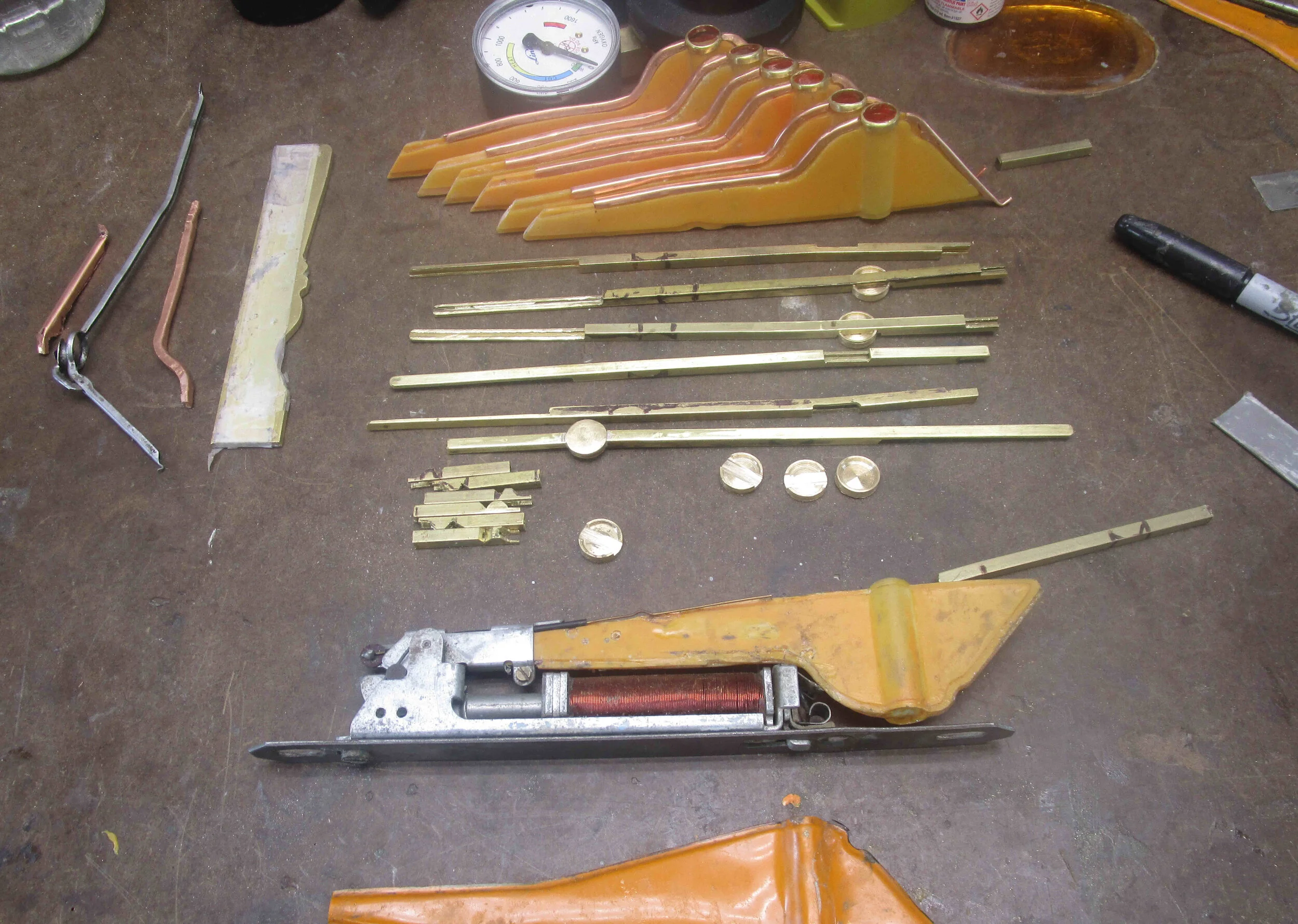 First batch of moulded fibreglass reinfored epoxy resin SF80 lens made, and fabricated arms from laminated square section brass rod, plus bottom arms from thin fabricated copper plate brass and stamped brass rings, ready for soldering