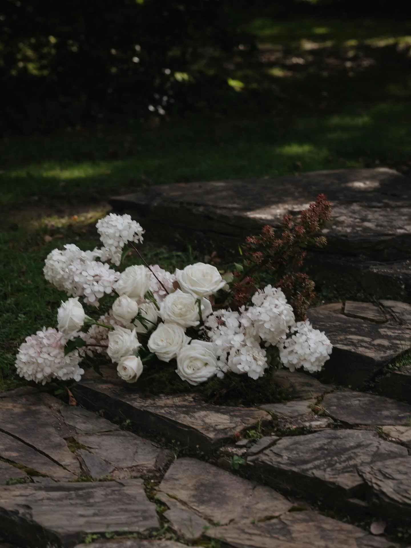 A lily pond flanked by slate stone steps. 
Surrounded by autumn trees and heritage walls.
A violinist to welcome your guests. 
The stillness and calm of the country air and birds above.
All set the tone for a beautiful garden ceremony to follow.

@mo