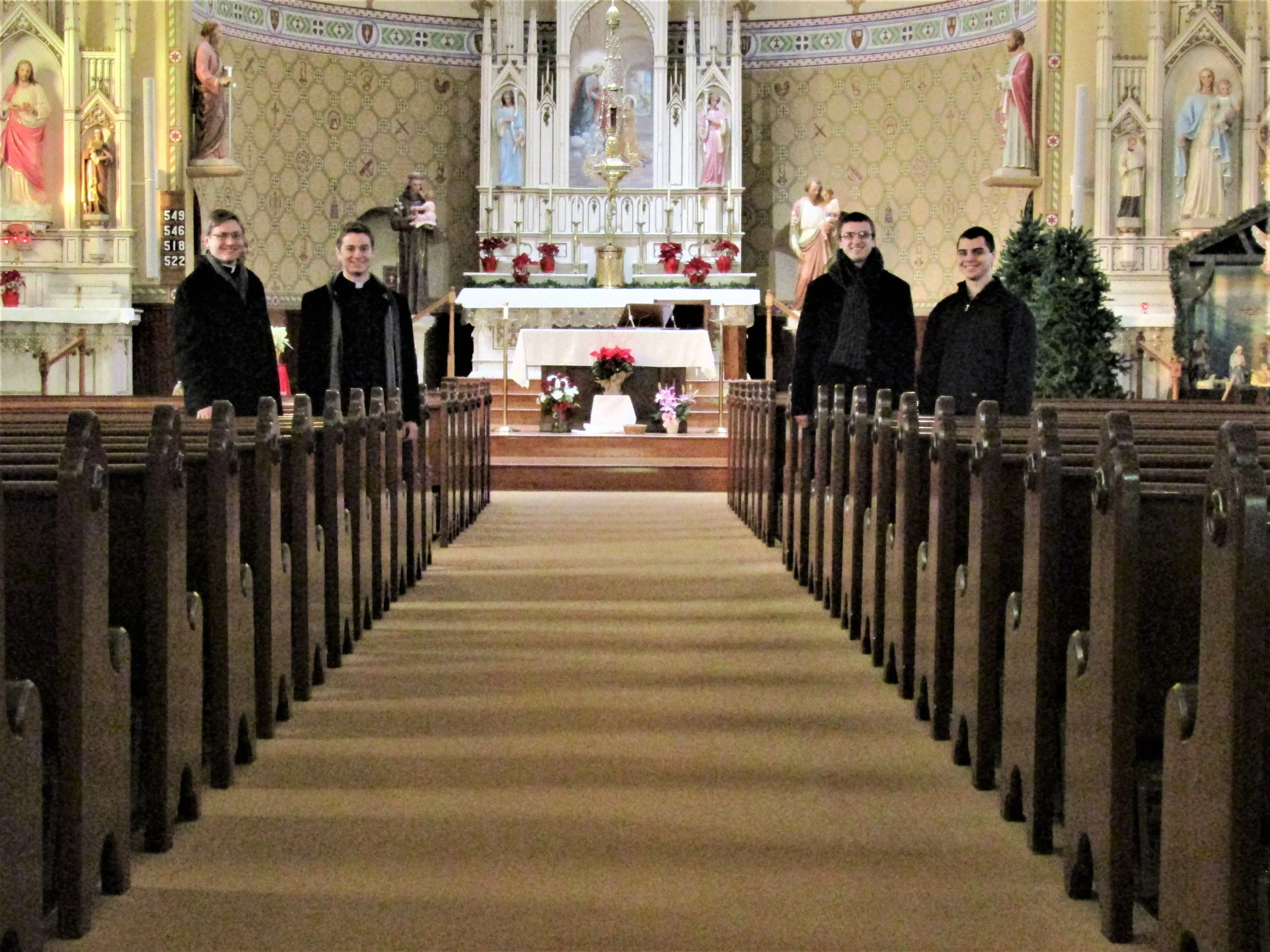Evan Huebl, John Hayes, and Shawn Polman visit with Tanner Thooft (St. John Vianney minor seminarian) during their trips to Region 3.