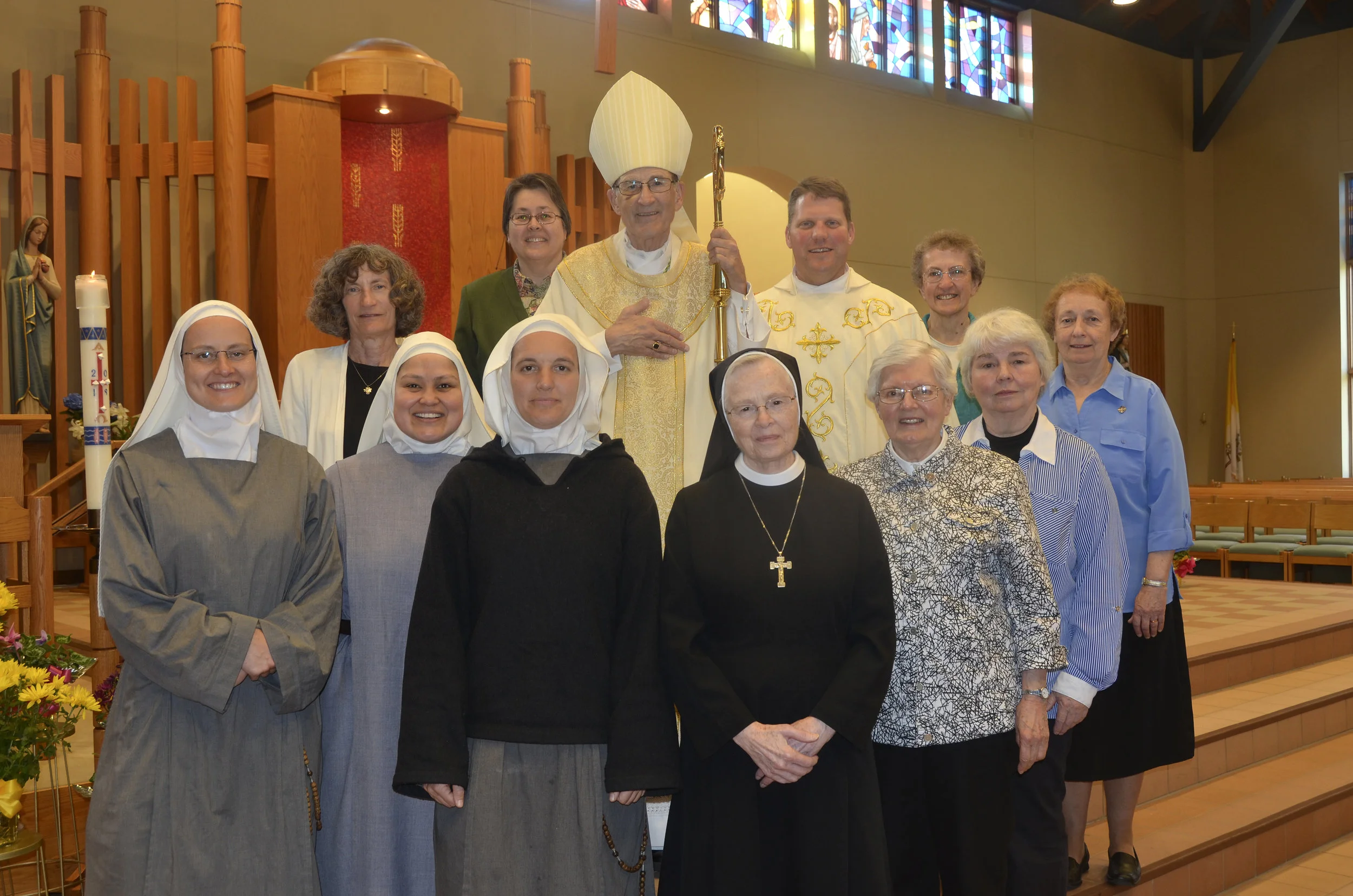 CELEBRATING CONSECRATED LIFE - On Saturday, May 4 at the Church of St. Catherine in Redwood Falls Bishop LeVoir celebrated Mass with special recognition to consecrated life, something the bishop does annually. A number of women religious who are currently serving in the Diocese of New Ulm were in attendance. They gathered for a photo and a special dinner with the bishop following the liturgy. Pictured are front row, l-r, Sr. Domitille, Sr. Pia Maria, and Sr. Aude all Sisters of Mary Morning Star; Sr. Bernadine Ugolini (Daughters of St. Mary of Providence), and Sr. Lenore Paschke and Sr. Carolyn Adams (Benedictine Sisters). Back-row, Sr. Lois Byrne (Presentation of the Blessed Virgin Mary), Sr. Candace Fier (Schoenstatt Sisters of Mary), Bishop LeVoir, Fr. Anthony Hesse, parish pastor and Sr. Mary Ann Kuhn (School Sisters of Notre Dame).