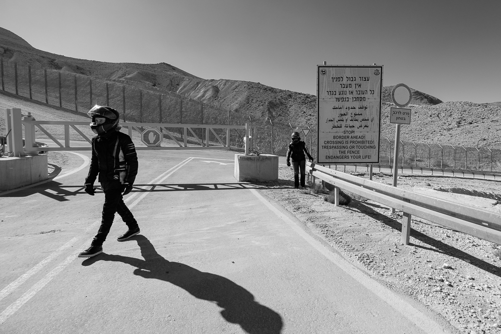 Hila Fenlon and her son, Jimmy Fenlon, stand near the warning signs posted all over the entrance of Rt. 10, stating "going beyond this point is entering at your own risk". 