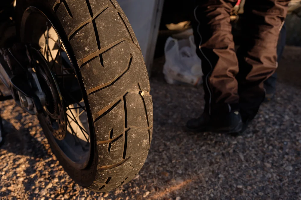 About 20 minutes before we arrived in Eilat, a local biker had a flat. When we stopped to assist him, apparently a bullet had hit his tire. The bullet was fired several days before and had finally hit a target. We all started to sarcastically laugh in this ironic event; " it's the sixth day old war. The shot was fired and it finally hit its destination". Israel is one of the few places in the world where a stray bullet hits a bike tire and no one calls the cops. They just all sit back and laugh with an unsurprised facial expression. 