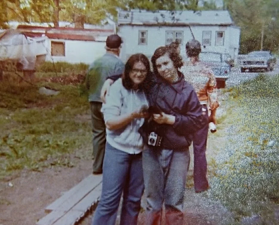 Unknown people. The photo is from the middle of our front yard facing the street. The white building is "The Bar".