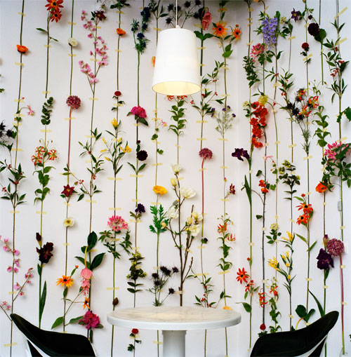 Real flowers are taped into the wallpaper. Tensta Konsthall