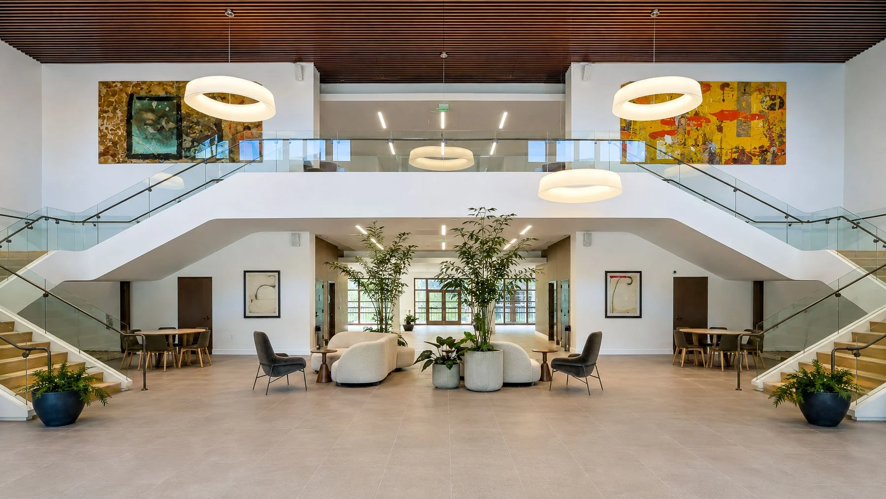 Renovated lobby with twin staircases and seating areas at The Park Calabasas.