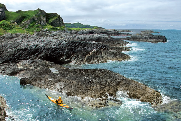 Todhunter paddling off the coast of Jura. Image by Gareth Brown, courtesy of National Geographic Adventure.