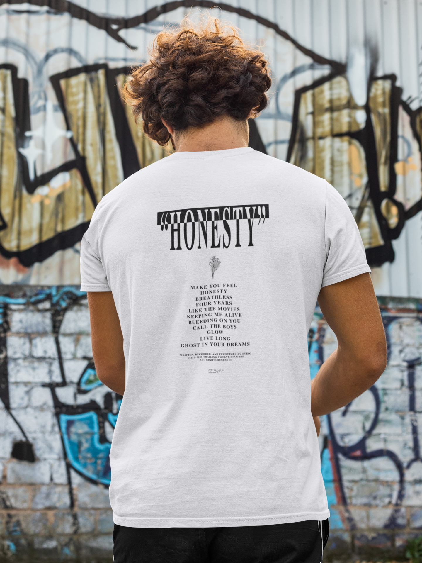 honsty_pi_back-view-t-shirt-mockup-of-a-man-in-front-of-a-wall-with-graffiti-m520.png