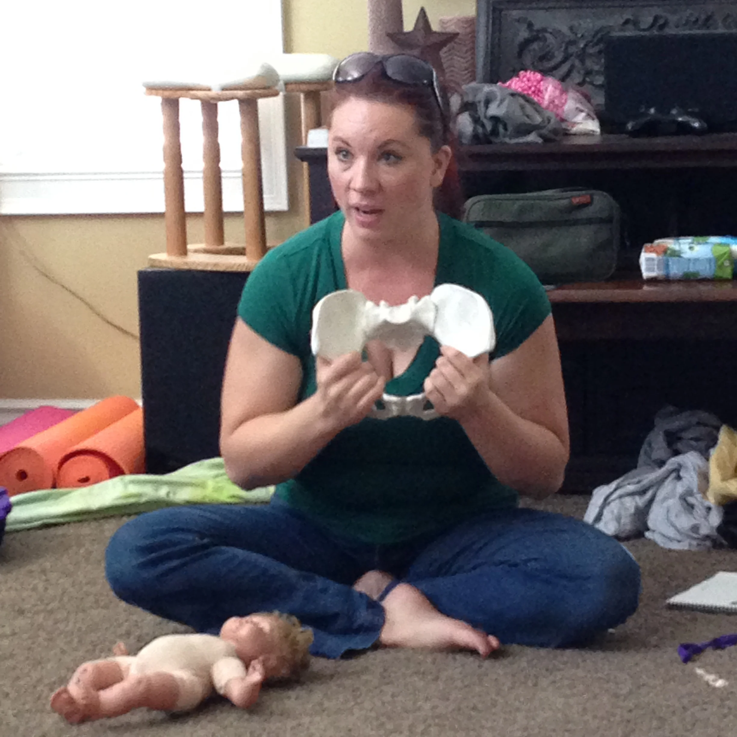 Lauralyn Curtis explaining how the pelvic bones shift during childbirth. 