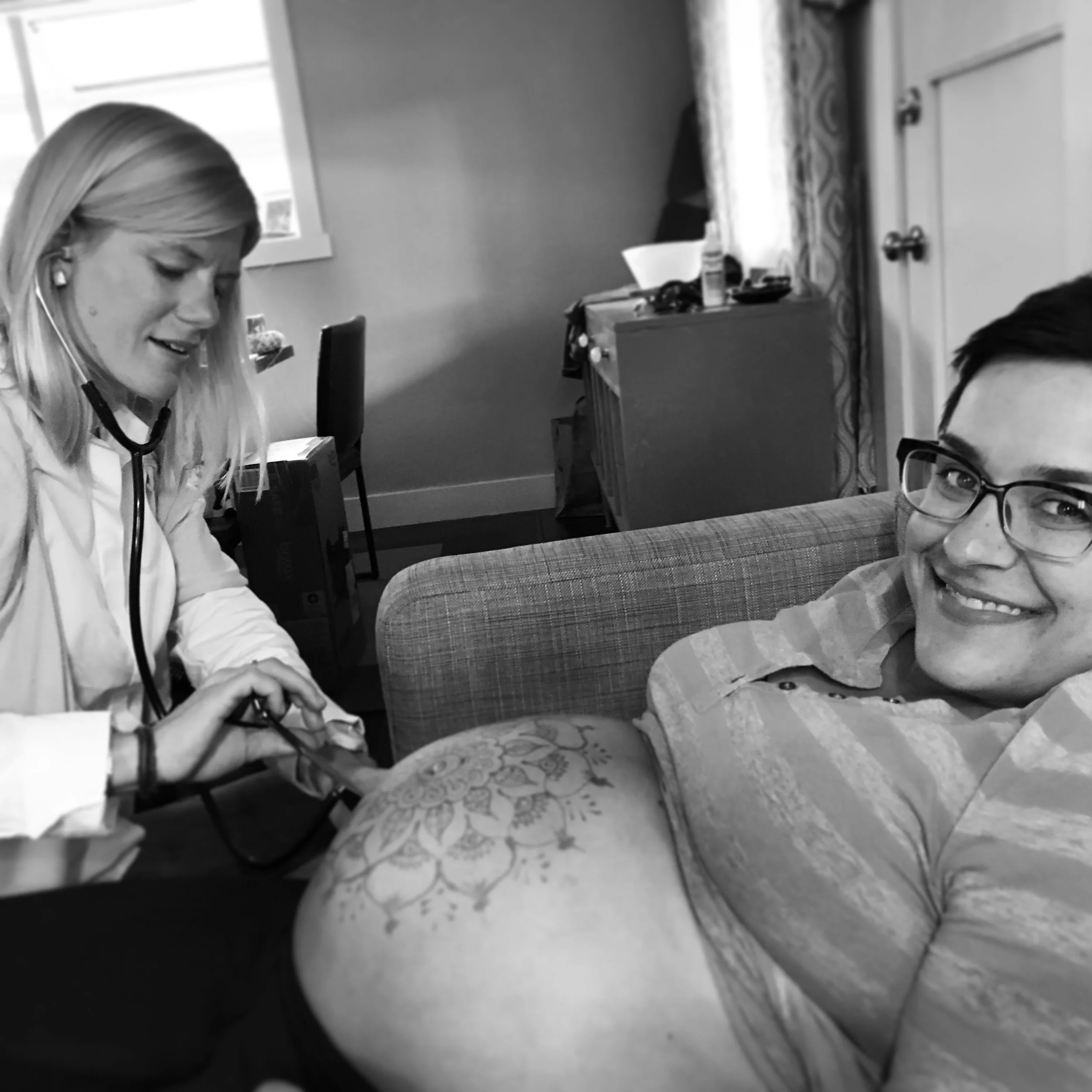 Adrienne listening to Shea's heartbeat