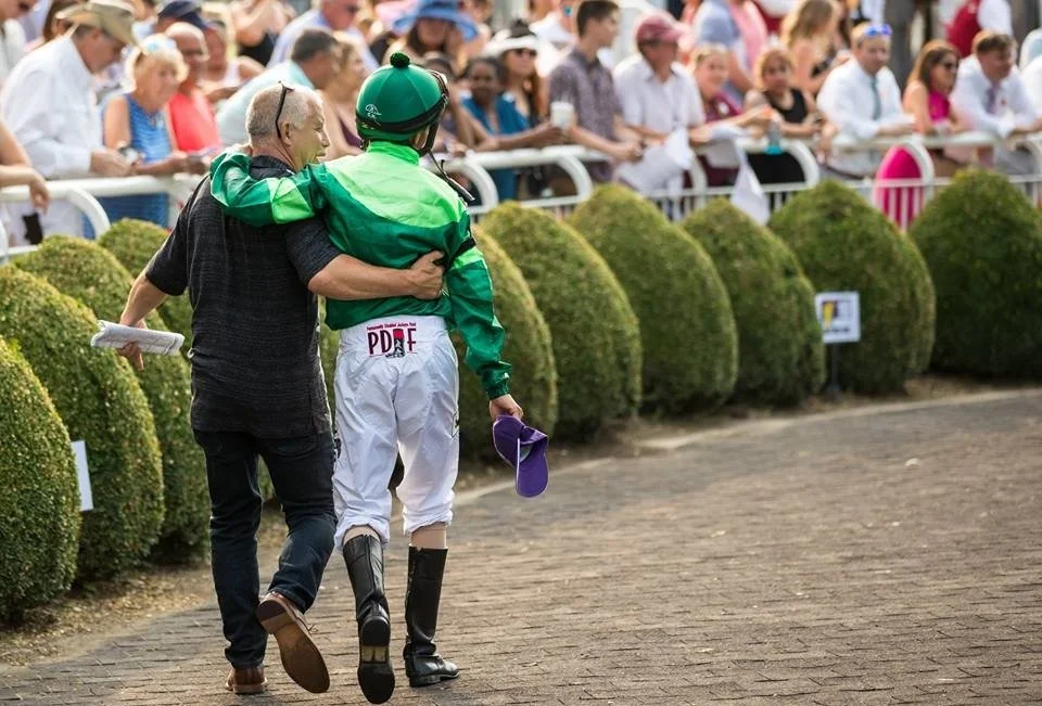 John Velazquez, sponsored by the Permanently Disabled Jockey Fund, wins the Beverly D at Arlington Park, 