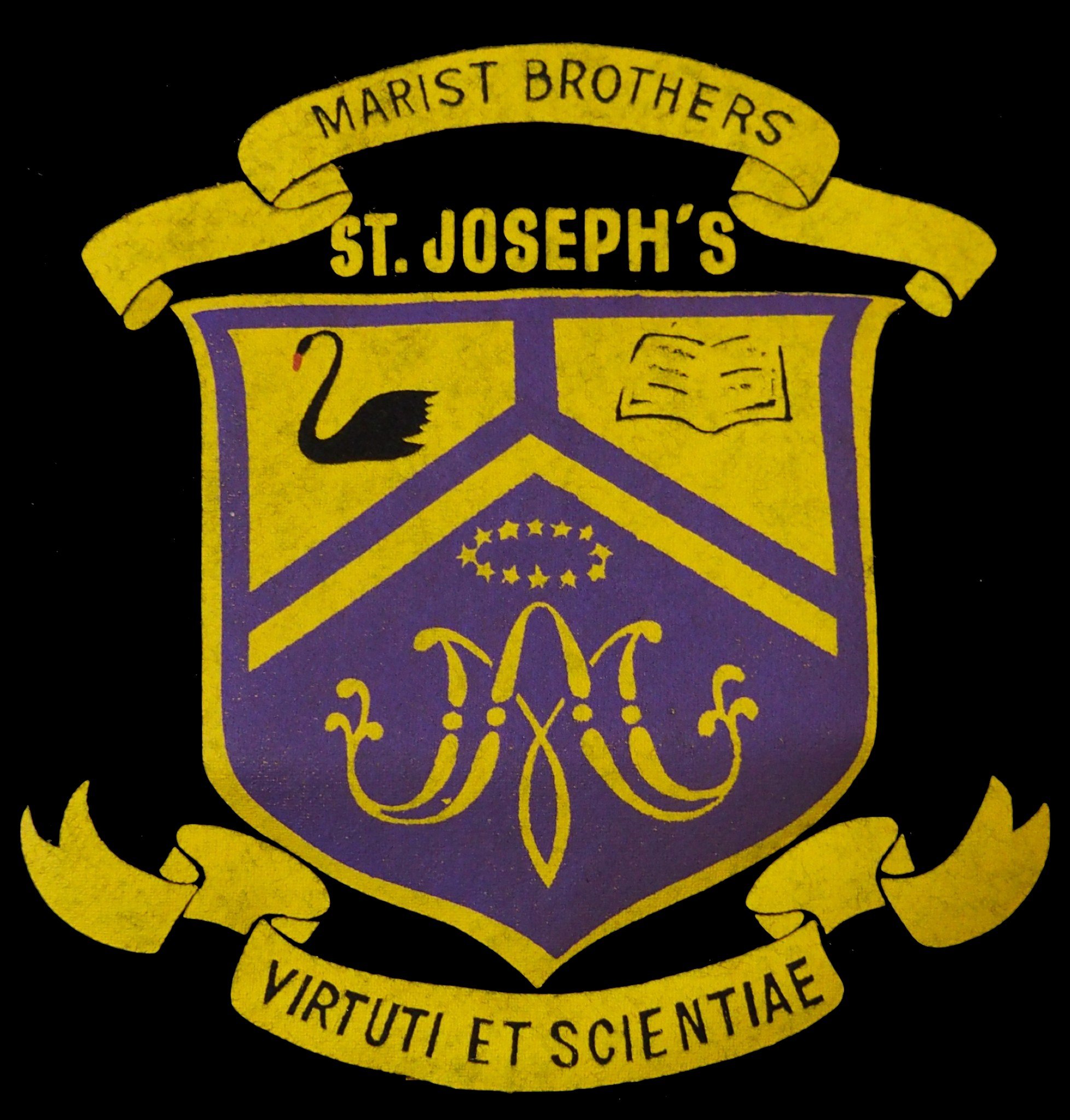  The beautiful St Joseph's College crest of purple and gold, and the reason the boys were often referred to as the 'Violet Crumbles'. 
