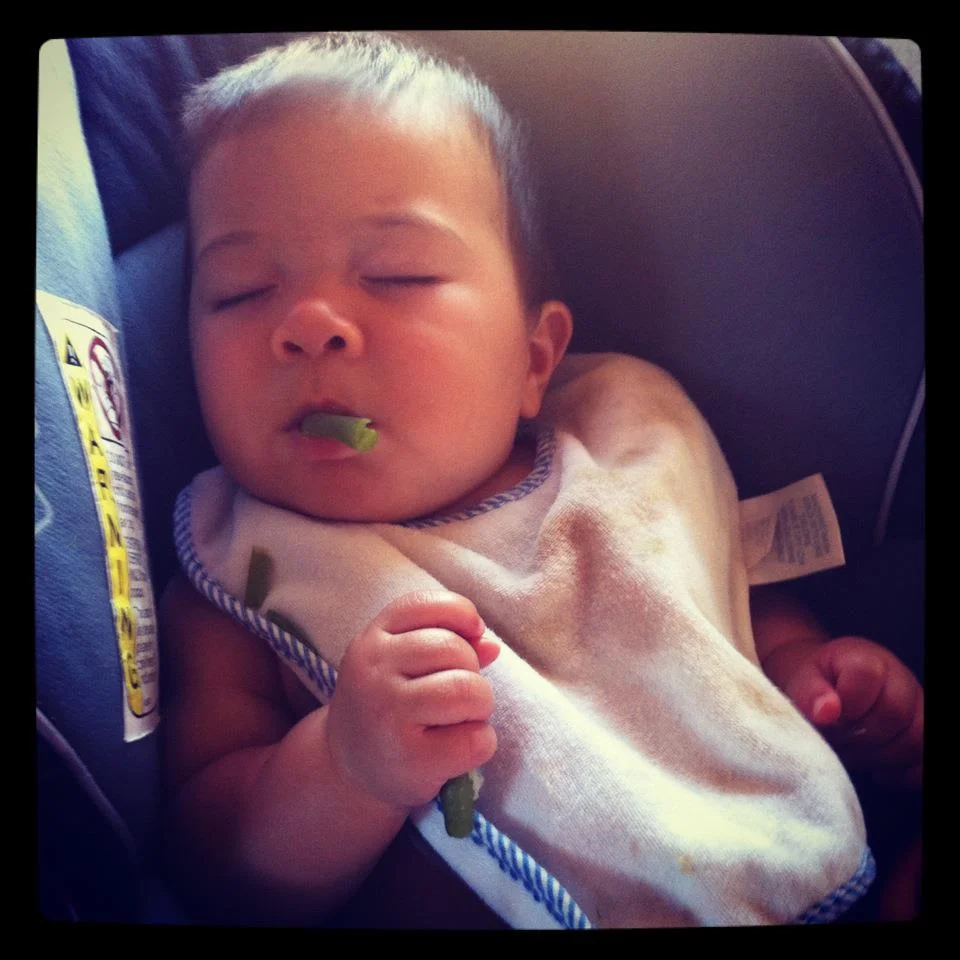 So tired during our 1st RV trip he fell asleep while eating green beans. 7 months' old - We were week two into introducing vegetables.