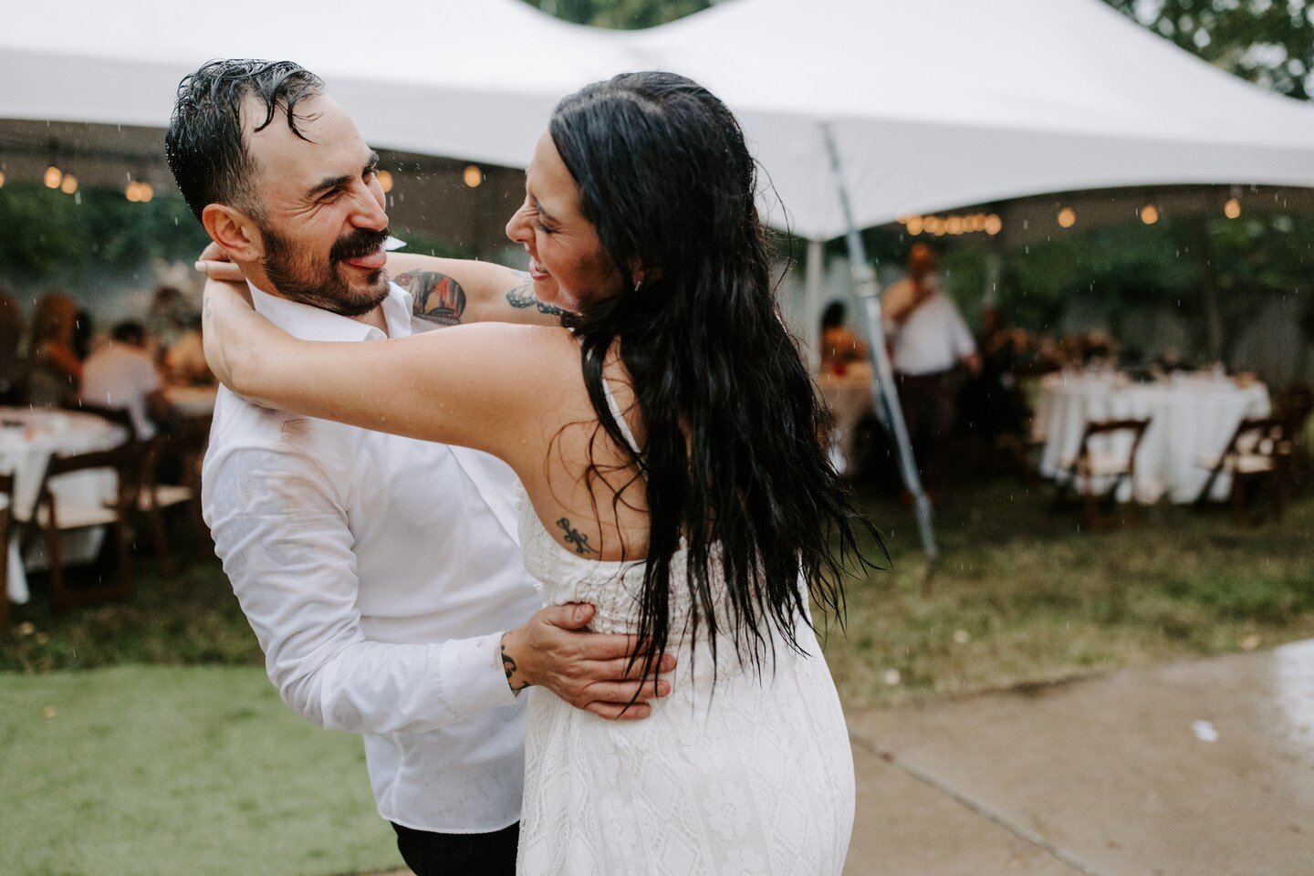 No fair weather love to be found here. These two didn't hesitate to kick off their shoes (literally), throw caution to the wind, and embrace the rain on their wedding day, and it was one of the most fun wedding days ever. There's something magical ab