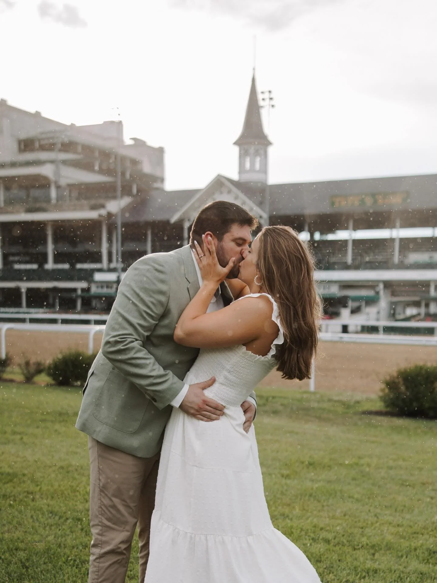 Some Louisville lovin&rsquo; at Churchill Downs in the rain ✨A little rain never hurts for some romantic vibes and a little extra something for an engagement session when you just embrace it!