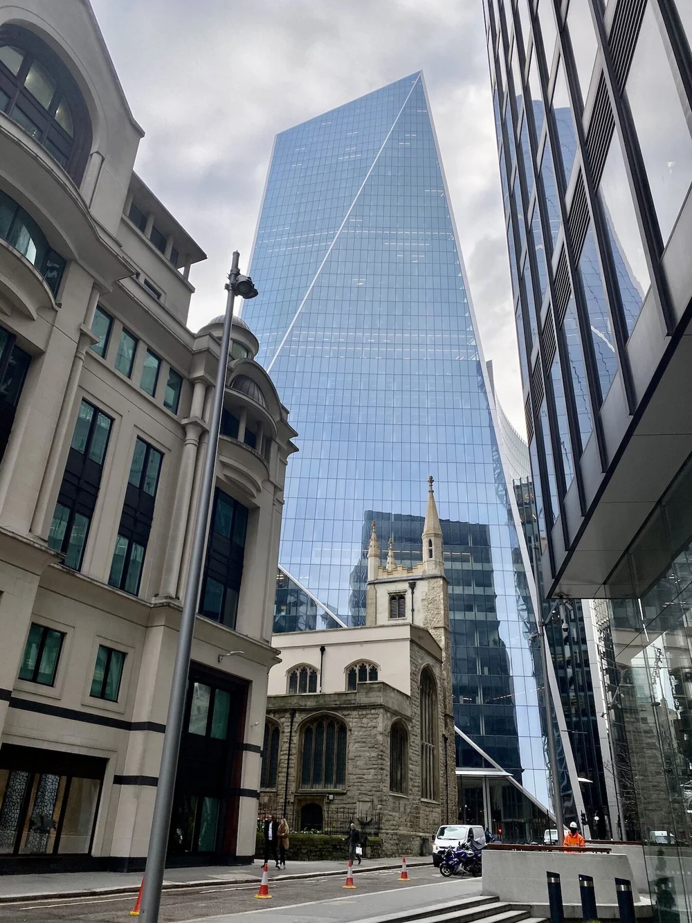  The Scalpel towers over the 16th-century St Andrew Undershaft church. 