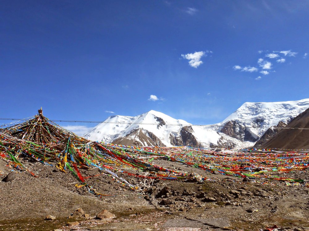  Mount Amnye Machen stands behind a stupa ringed by prayer flags. 