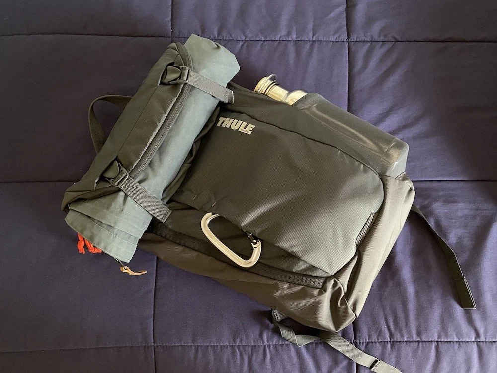  The fully-packed Thule Enroute 20L with a jacket rolled under the front compression straps. 