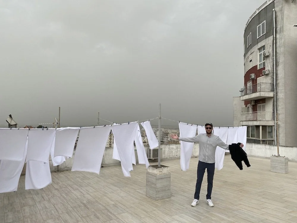  Wearing the Evolution Pants and Limitless Merino Button-down amidst a dust storm hitting Durrës, Albania. 