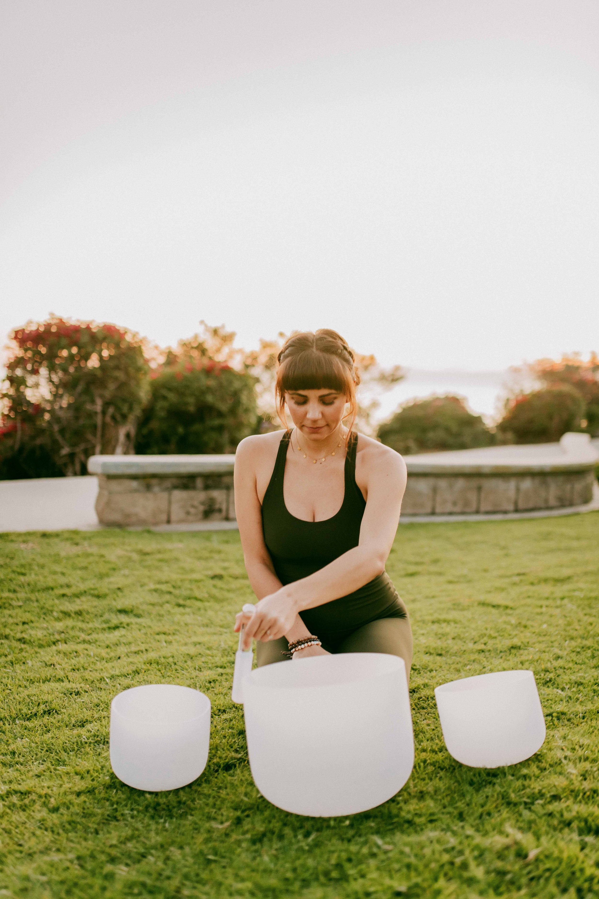  Young women practice yoga poses on San Clemente State Beach for a photoshoot 