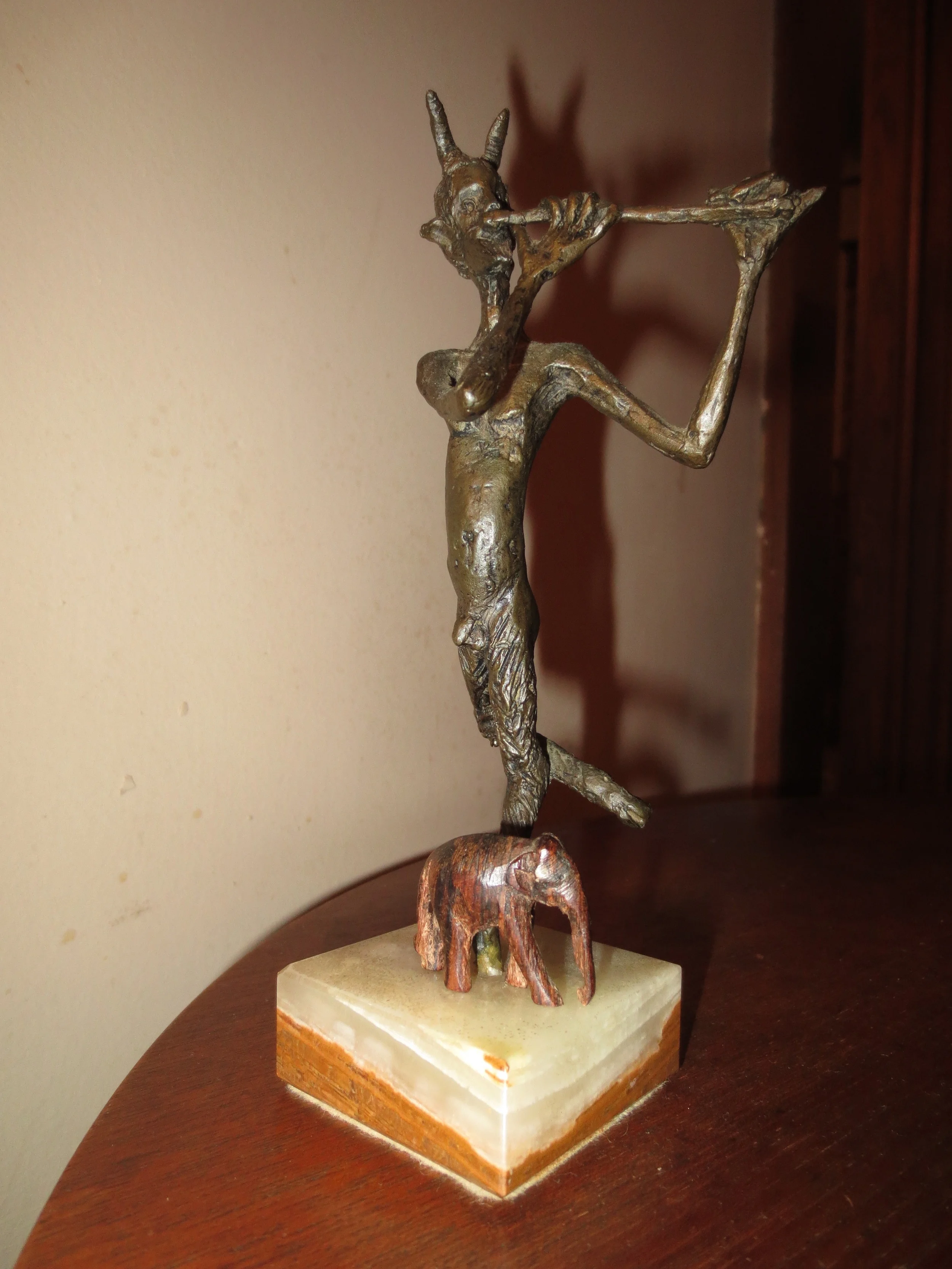 THE ebony elephant, standing on the base of a Pan figure, on a table in Daryl Sharp's consultation room.